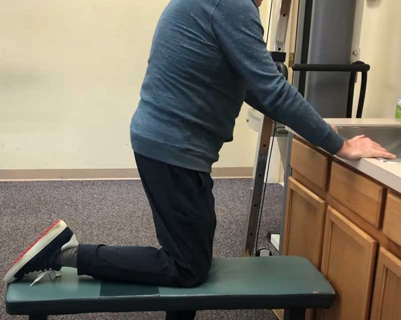 Kneeling on a bench after total knee replacement
